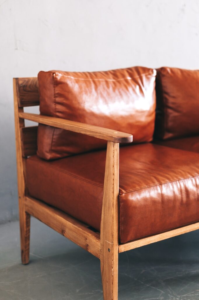 Interior detail of modern living room with brown leather sofa. Close-up.